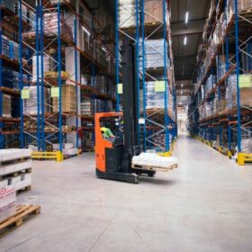 industrial-building-large-warehouse-interior-with-forklift-palette-with-goods-shelves_342744-1492