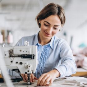 woman-tailor-working-sewing-factory_1303-15843